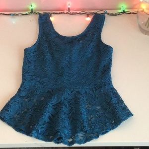 Blue lace blouse with bow in the back